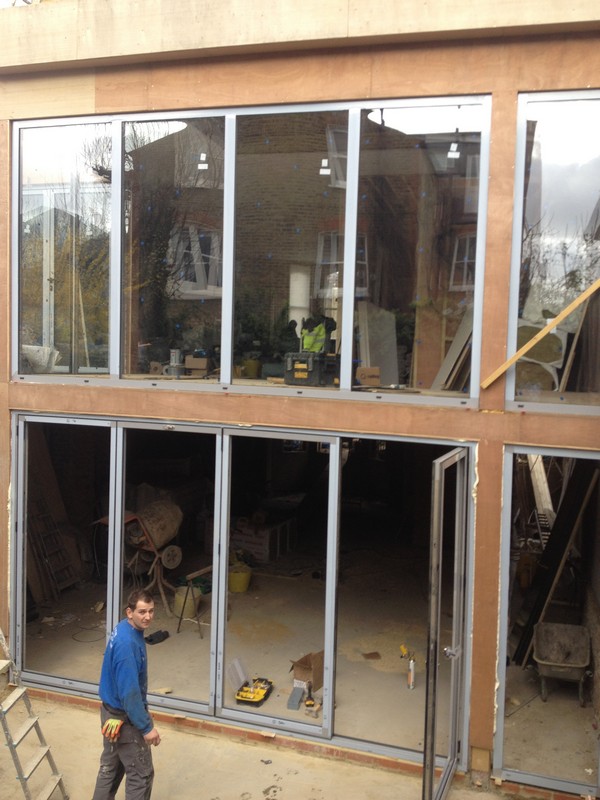 Aluminium bi-fold doors with two-storey glazing in Barnes